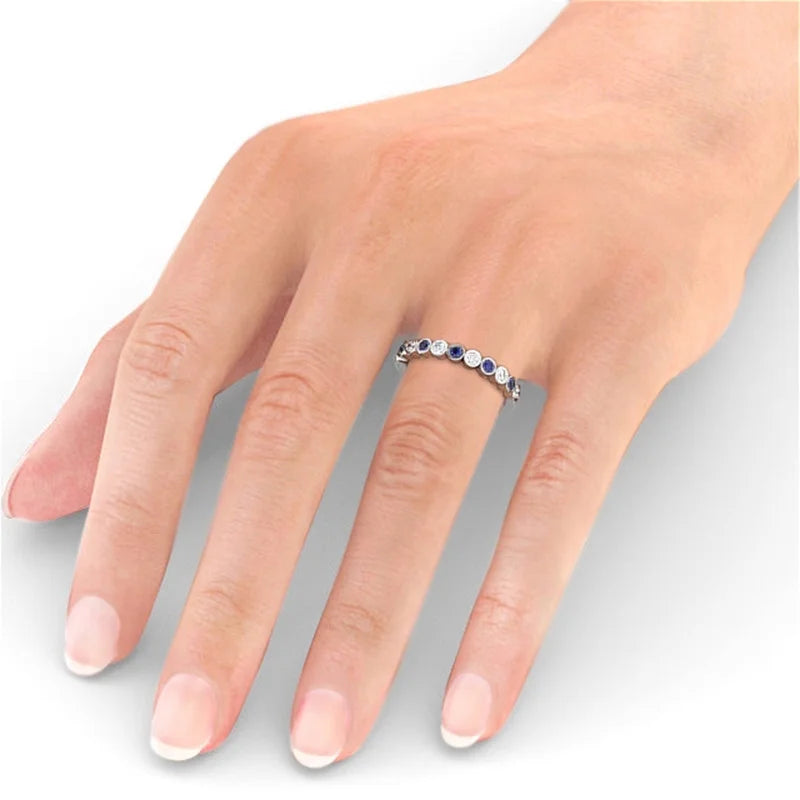 14K White Gold Eternity Band with Round Cut Diamond and Blue Sapphire B636351